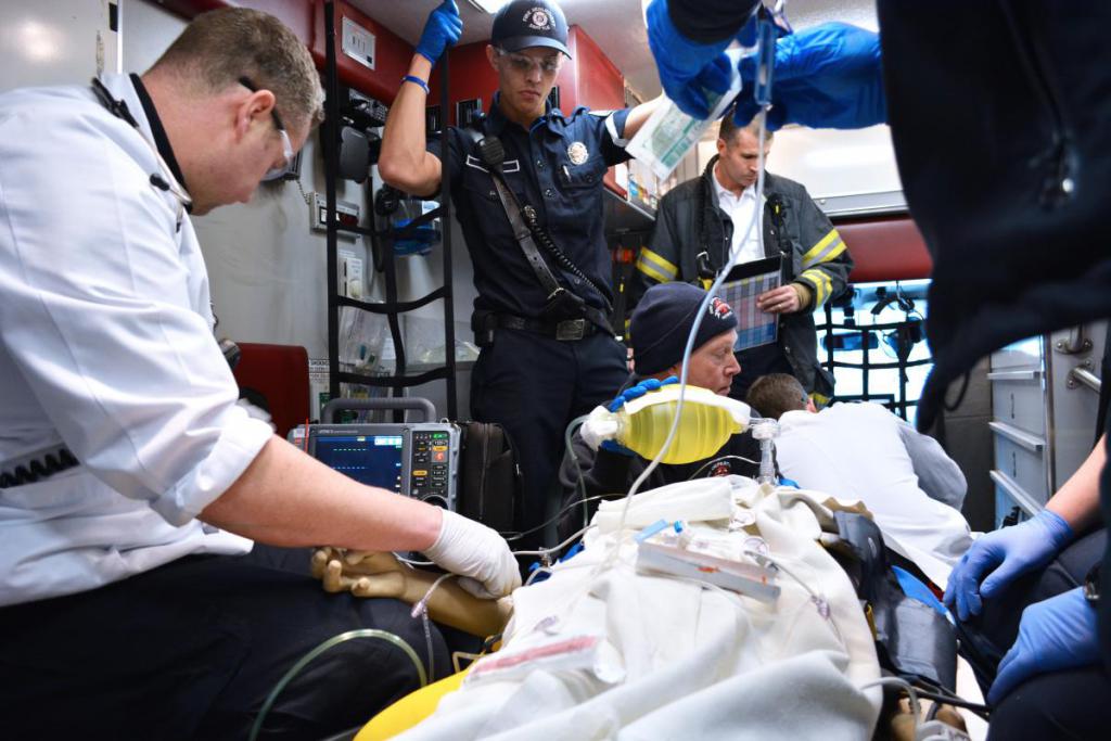Students working to revive an accident victim.